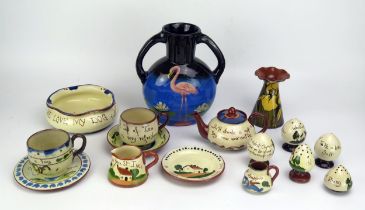 A collection of Torquay pottery wares, includes condiments, vases, teapot and bowls.
