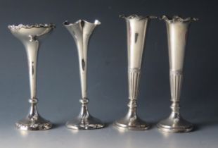 A pair of late Victorian silver specimen vases, maker's mark worn, London, 1890, of trumpet-shaped