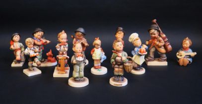 A collection of twelve Hummel figures including child street musicians, chef and other figures. (12)