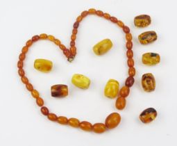 An Amber Graduated Bead Necklace, largest bead 18.7x14.1mm, 17.53g and other beads 24.33g