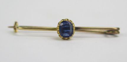 A Precious Yellow Metal and Blue Stone Brooch, 34.8mm long, 5.5x4.4mm claw set stone, KEE tested