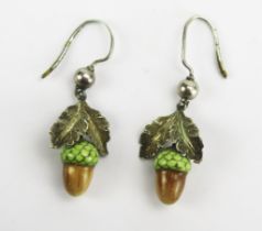 A Pair of Antique Enamel Acorn Pendant Earring in a precious white metal mount with chased