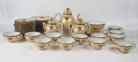 An early 20th century Japanese eggshell porcelain, twelve setting tea service decorated with