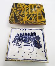 A large square slipware dish with abstract web design, 33cm wide, together with a square tin glaze