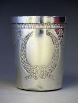 A French silver tumbler, maker LB, of cylindrical tapering form, with repousse garland and ribbon