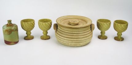 A Grayshott pottery casserole dish and cover with banded ribbed decoration, four Aylesford stoneware