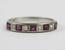 An 18ct White Gold, Ruby and Diamond Half Eternity Ring, 4mm wide band, stamped 18CT, maker G&S, U.