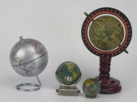 A lithographed tinplate tape measure in the form of a terrestrial globe, 4.5cm diameter, together