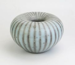TIM ANDREWS (born 1960) Raku Humbug Form, burnished and smoke fired duck egg blue surface, impressed