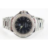 A TAG Heuer Formula 1 Diamond Bezel Black Dial Wristwatch on TAG steel bracelet together with box,