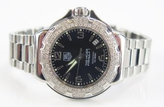 A TAG Heuer Formula 1 Diamond Bezel Black Dial Wristwatch on TAG steel bracelet together with box,