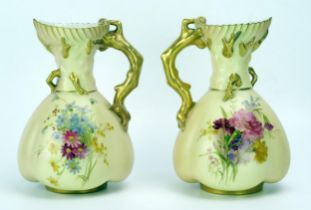 A matched pair of Royal Worcester blush ivory jugs, of lobed ovoid form, with painted floral