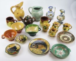 A collection of continental pottery items, including jug and matching cups, Spanish tin glaze jug,