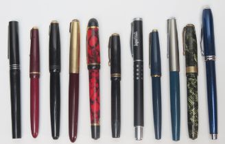 A collection of assorted fountain pens, various makers including Parker 51, Parker Blue Lady 17,