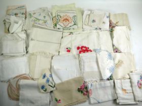 A collection of assorted embroidered table linen, napkins, tablecloths etc.