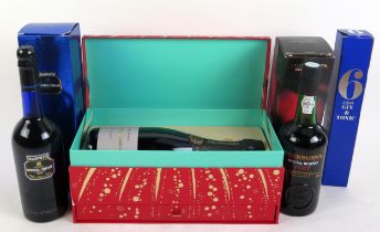 A bottle of Fortnum & Mason Champagne in presentation box, a bottle of Harvey's Bristol Cream,