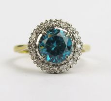 An 18ct Gold, Blue Zircon and Diamond Cluster Ring, 7.54mm principal platinum claw set stone, 12.5mm