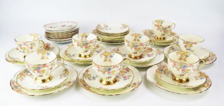 A Foley bone china part tea service with floral decoration heightened in gilt, includes eight cups