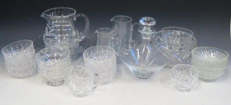 A collection of assorted cut glass wares, includes trumpet-shaped vase, decanters, sundae dishes,