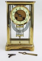 A lacquered brass four-glass mantel clock of rectangular outline, the circular movement with 9cm