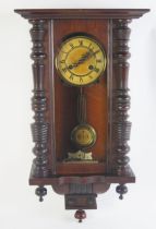 A late 19th century mahogany wall clock, with 14cm Roman dial, the movement with grid iron