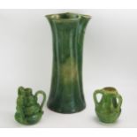 A large Farnham pottery vase of cylindrical trefoil outline, with variegated green glaze, 44cm high,