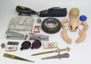 A collection of assorted advertising items including Guinness bottle brush, Jaguar car mascot, Dinky