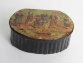 A Victorian papier mache snuff box of oval form, the hinged lid decorated with printed view of