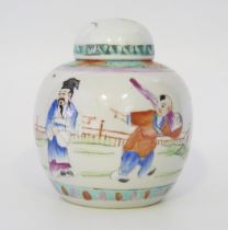 A Chinese Famille verte decorated ginger jar and cover, decorated with figures in a garden