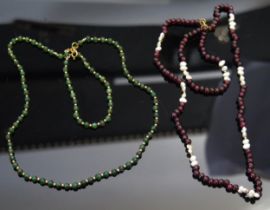 A 9ct Gold and Garnet Necklace and Bracelet and a 9ct gold and green stone necklace and bracelet