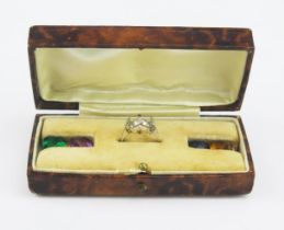 A Cased Silver Ring with four interchangeable paste specimens, size J