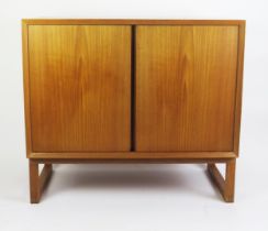 A 1960's Danish Teak Two Door Cabinet with single adjustable shelf, stamped MADE IN DENMARK, 80(l)