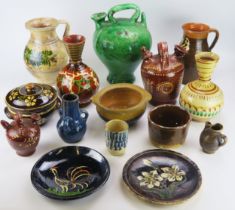 A collection of continental pottery wares mostly French, including wine ewers, vases, plates,