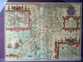 After John Speede, a hand coloured engraved map of Caernarvon, with vignettes of Caernarvon and
