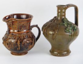 An oxide glazed jug possibly by Agnete Hoy, 20cm high together with a jug possibly by Farnham