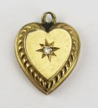 A Precious Yellow and Diamond Heart Shaped Pendant, 12.6mm drop, KEE tested as 9ct, .79g UNLESS