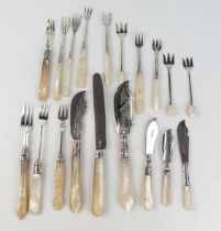 A collection of Mother-of-Pearl handle and silver butter knives, olive forks, pickle forks various