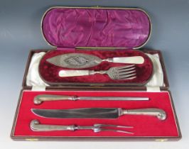 A silver handled three-piece carving set, the knife, fork and steel with pistil grip handles, cased,