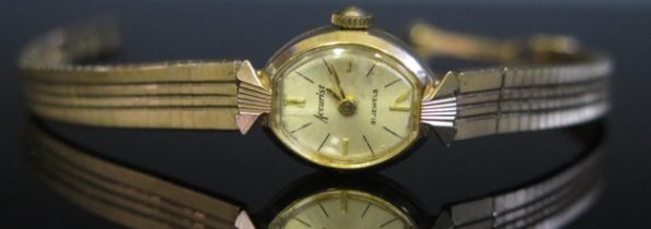 An Accurist Ladies 9ct Gold Wristwatch on 9ct gold bracelet, 12g nett. Running