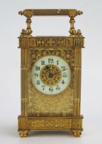 A late 19th century French gilt brass carriage timepiece, with 5cm ivorine Arabic chapter ring