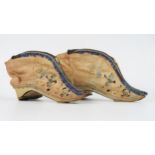 A pair of late 19th century Chinese silk shoes of traditional design decorated with birds to a