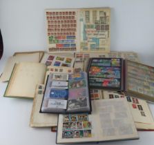 A Large Collection of World Stamps arranged in albums and stock books including a large quantity