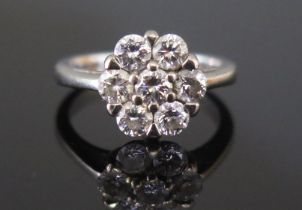 A Modern 18ct White Gold and Diamond Cluster Ring set with six c. 3.7mm brilliant round cuts, 11mm