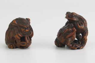 A Japanese carved hardwood netsuke of two toads, signed, 3.5cm high, together with another boxwood