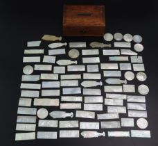 A collection of part sets of Chinese mother-of-pearl gaming counters, various shapes and sizes.