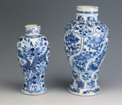 A Chinese blue and white vase of ovoid form decorated with panels of floral sprays, with raised
