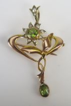 An Antique 9ct Gold, Peridot and Seed or Cultured Seed Pearl Pendant / Brooch, c. 41mm drop, Stamped