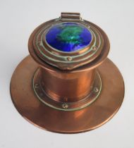 Jesson Birkett & Co. An Arts & Craft copper inkwell, of cylindrical form, the hinged lid with