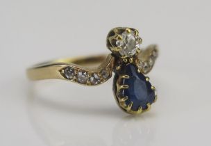 An 18ct Gold, Sapphire and Diamond Ring, c. 6.4x4.6mm pear cut claw set sapphire and a c. 4mm old