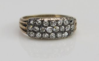 An Antique Old Cut Diamond Three Row Ring in a precious yellow metal setting, c. 14.8x7mm head, size